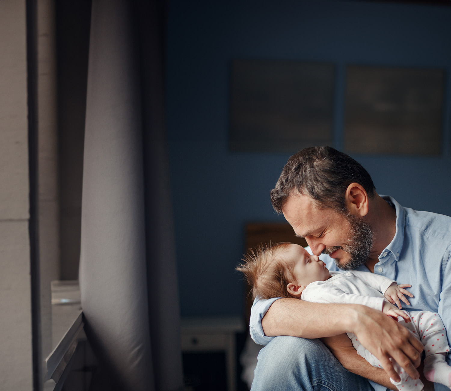 Male fertility treatments with a man holding a baby