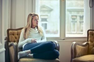 Woman sitting on chair wondering about what ovulation is