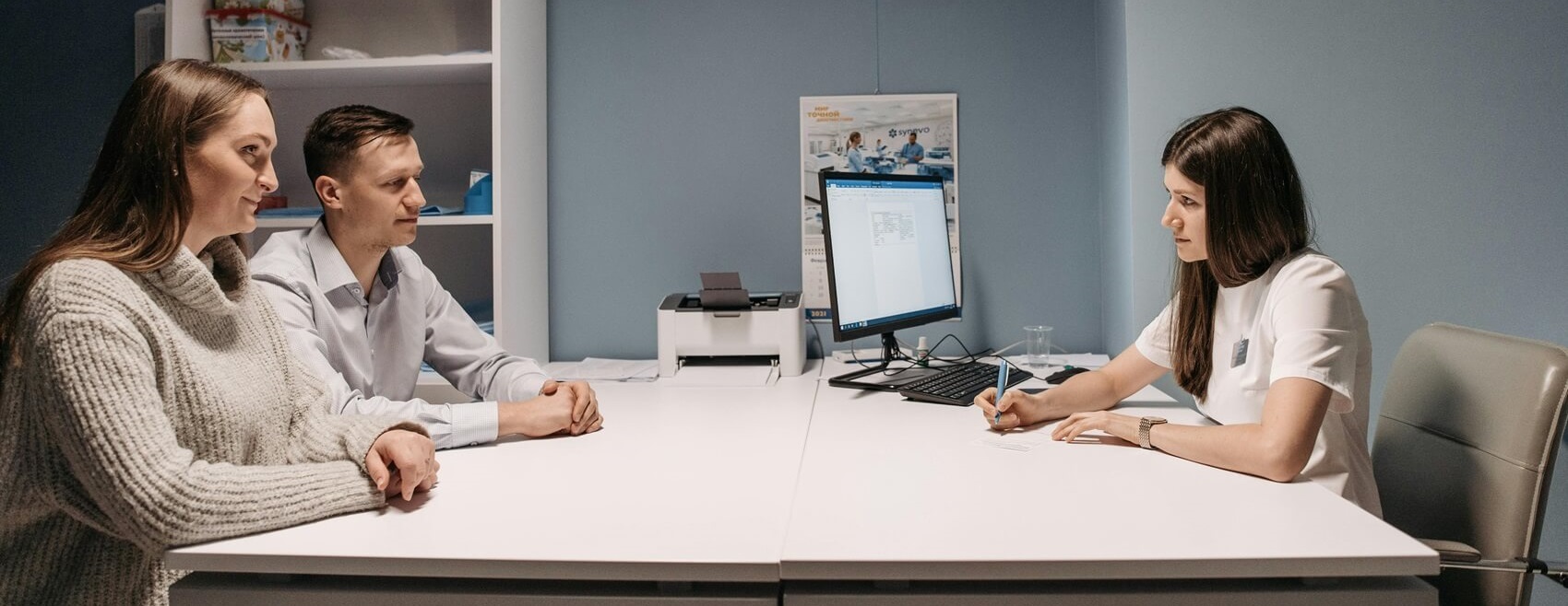 Couple consulting with doctor about IVF